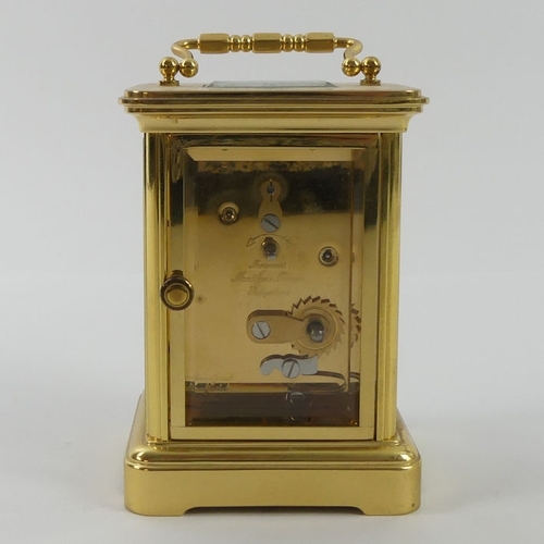 287 - A Matthew Norman brass carriage clock, 11cm x 7cm.