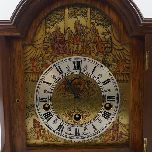 298 - A walnut cased bracket clock by Christian Huygens with a train chiming movement, 27cm x 23cm.