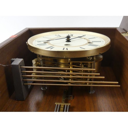 297A - Hermle chiming wall clock, with key and pendulum. 68 x 29cm.