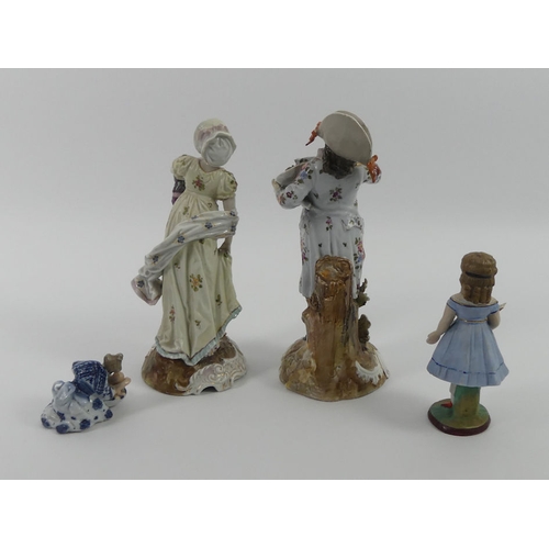 304 - A pair of Rudolstadt figures and a rocking figure along with a figure of mother washing her child, t... 