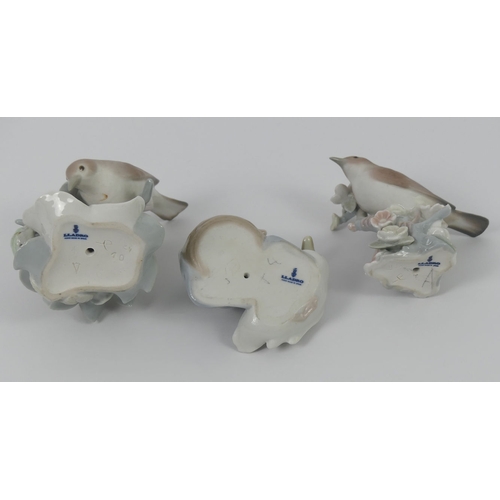 326 - Two Lladro porcelain bird figurines and a duck and ducklings group, 12cm.