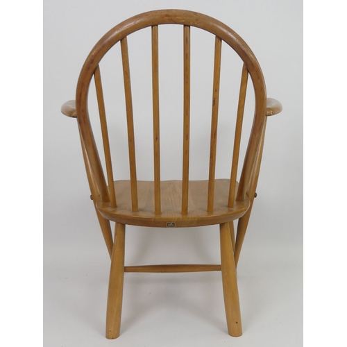 508 - An elm Ercol child's armchair. H70cm