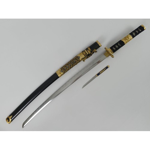 197 - A fine quality decorative Katana with brass mounts and fittings in a decorative scabbard, blade 68cm... 