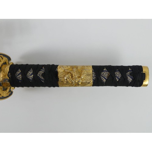 197 - A fine quality decorative Katana with brass mounts and fittings in a decorative scabbard, blade 68cm... 