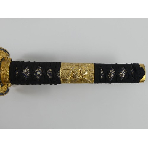 197 - A fine quality decorative Katana with brass mounts and fittings in a decorative scabbard, blade 68cm... 