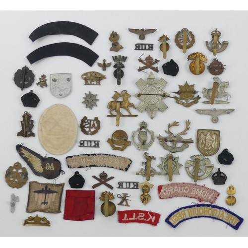 192 - A tin of cap badges including FGH Canada, Carleton, York, Cornwall regiment, ATS together with sleev... 