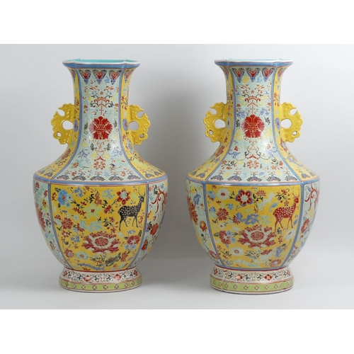 352 - A large pair of Chinese yellow and turquoise ground vases decorated with Flora and Fauna, 50cm.  Col... 