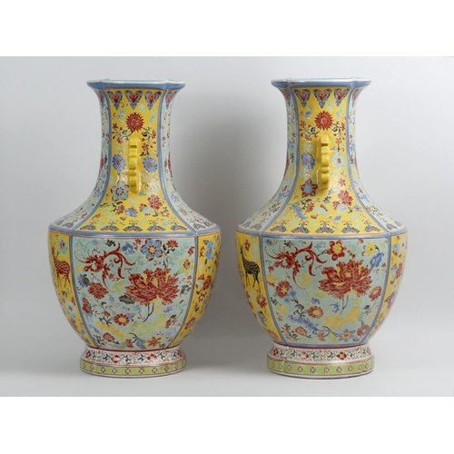 352 - A large pair of Chinese yellow and turquoise ground vases decorated with Flora and Fauna, 50cm.  Col... 