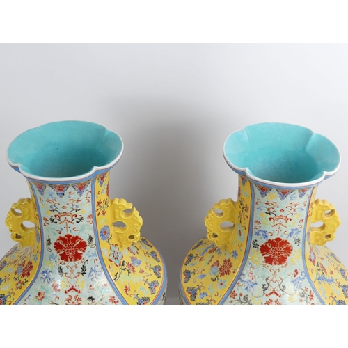 352 - A large pair of Chinese yellow and turquoise ground vases decorated with Flora and Fauna, 50cm.  Col... 