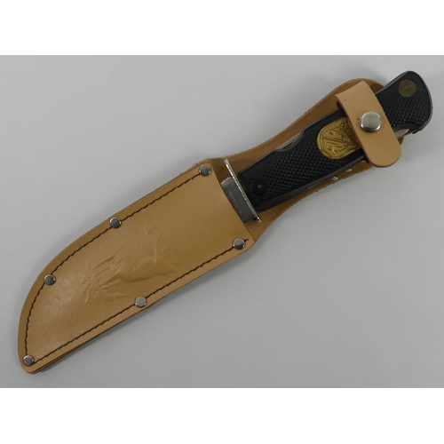 259 - A German Decora Solingen multi tool hunting knife and sheath, blade 13.5cm.