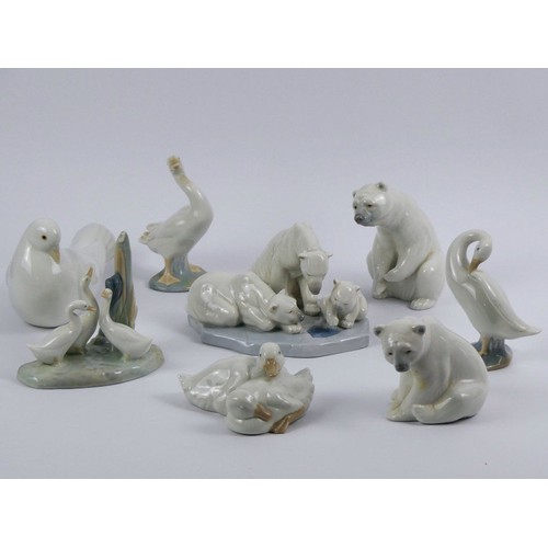 373 - Five Lladro animal figures, including Polar Bear group 'Bearly Love' 1443 together with three Nao an... 