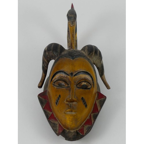 441 - A carved African tribal Gura mask, 43cm x 19cm.