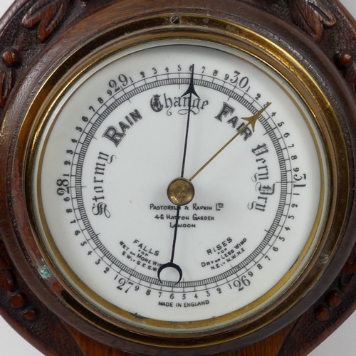 301A - An Edwardian oak aneroid banjo barometer, London maker, 64cm.