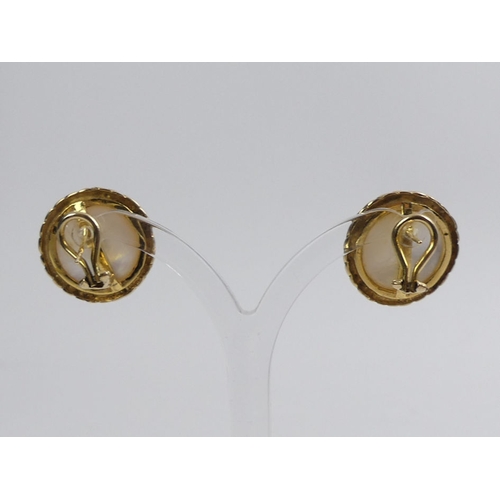 11 - A pair of 9ct gold Mabe pearl earrings, 8.7 grams, 18.3mm diameter.