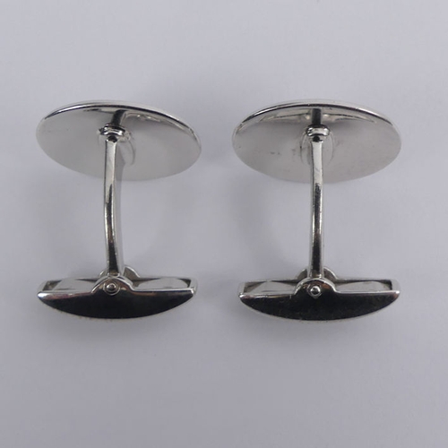 12 - A pair of 18ct white gold cufflinks with enamel fish design, Birm. 1999, 15.2 grams, 18.4mm.