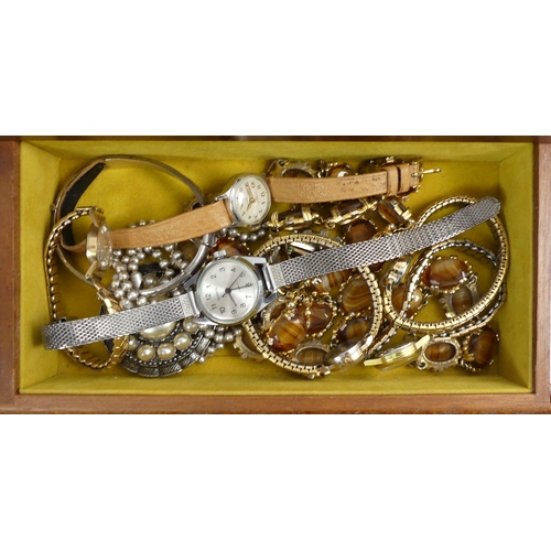 13 - A jewellery box and contents including silver items and watches.