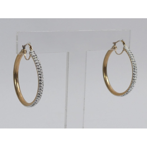 19 - A pair of 9ct gold crystal set hoop earrings, 2.3 grams, 32mm diameter.