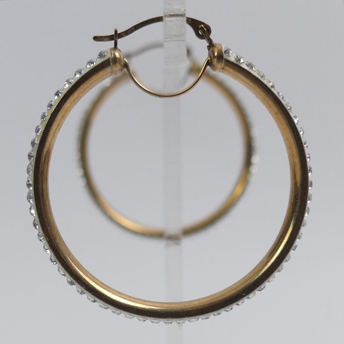 19 - A pair of 9ct gold crystal set hoop earrings, 2.3 grams, 32mm diameter.