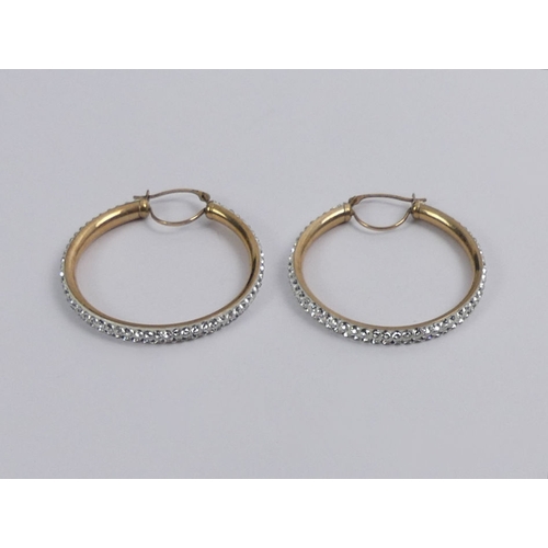 19 - A pair of 9ct gold crystal set hoop earrings, 2.3 grams, 32mm diameter.