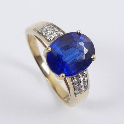 21 - 9ct gold sapphire and white topaz ring, 3.5 grams, 10mm, size P.