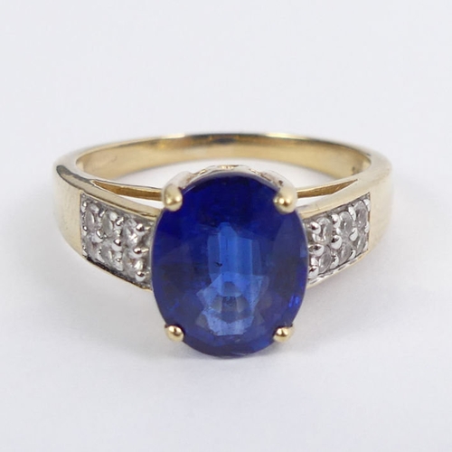 21 - 9ct gold sapphire and white topaz ring, 3.5 grams, 10mm, size P.