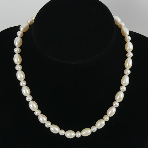 31 - Cultured oval and round pearl necklace with a 9ct gold clasp, 45 grams, 44cm x 8.7mm.