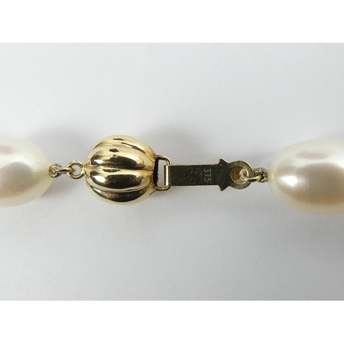 31 - Cultured oval and round pearl necklace with a 9ct gold clasp, 45 grams, 44cm x 8.7mm.