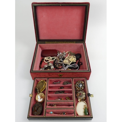 34 - A jewellery box of Victorian and later jewellery, including cameos and silver brooches.