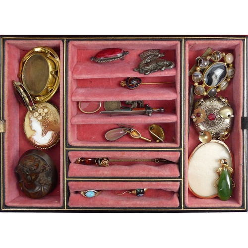 34 - A jewellery box of Victorian and later jewellery, including cameos and silver brooches.