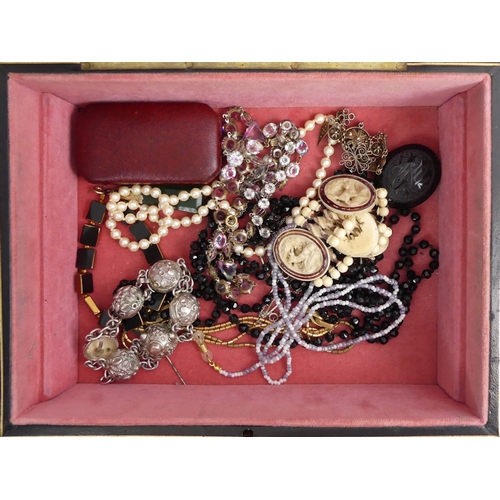 34 - A jewellery box of Victorian and later jewellery, including cameos and silver brooches.