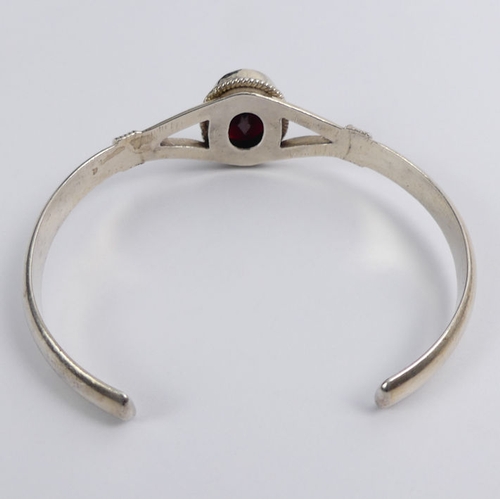 35 - Sterling silver garnet set cuff bangle, 23.3 grams, 19.7mm.