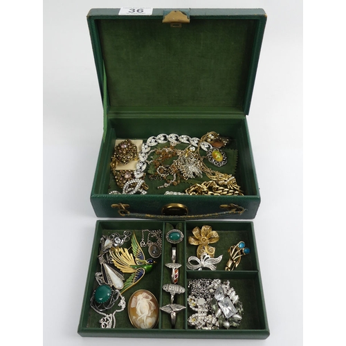 36 - A jewellery box of costume and silver items, including rings and brooches.