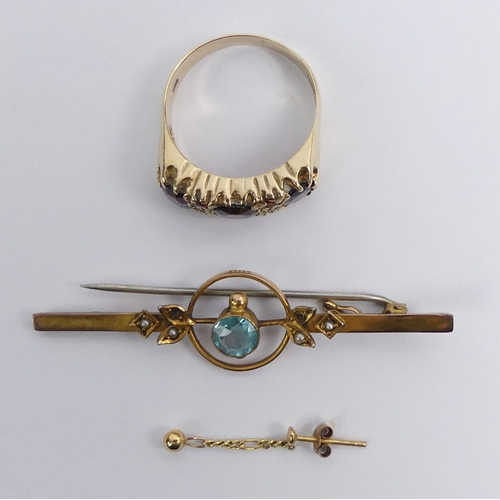 45 - A 9ct gold, garnet ring, a blue stone 9ct brooch and single gold earring, 7.8 grams, ring size U.