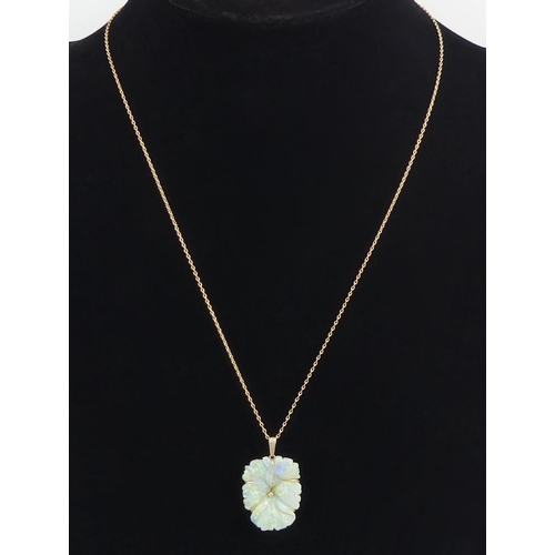 7 - 9ct gold carved opal flower design pendant and chain, 5.7 grams, chain 48cm, pendant 30mm.