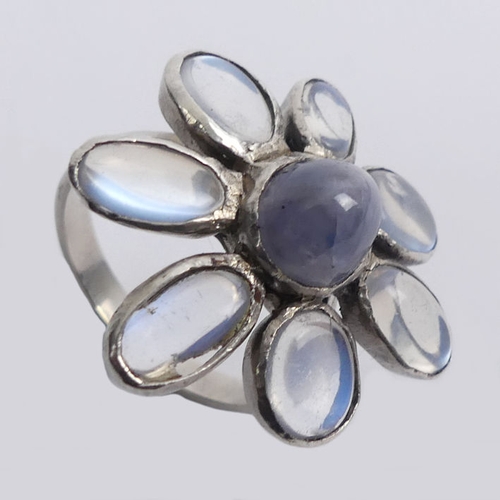 50A - Sterling silver moonstone flower design ring, 6.8 grams. Size S 1/2, 26.5 mm wide.