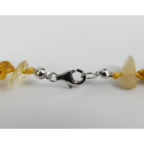 51 - Citrine multi-strand necklace with a silver clasp, 46 grams, 50cm.