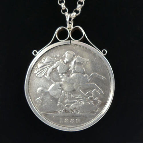 56 - Victorian 1889 silver crown pendant and chain, 44 grams, chain 70cm, 40mm in diameter.