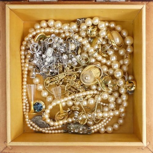 57 - A box of mixed costume jewellery, including an amber bead necklace and paste set brooches, along wit... 