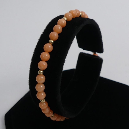 58 - 9ct gold coral bead necklace and matching bracelets, 12.8 grams, beads 4.1mm, necklace 41cm.