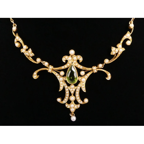 62 - 18ct gold, peridot and seed pearl necklace, 13.8 grams, 37cm.