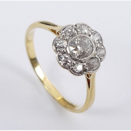 65 - 18ct gold diamond daisy ring, 1.7 grams, 8.5mm, size J 1/2.