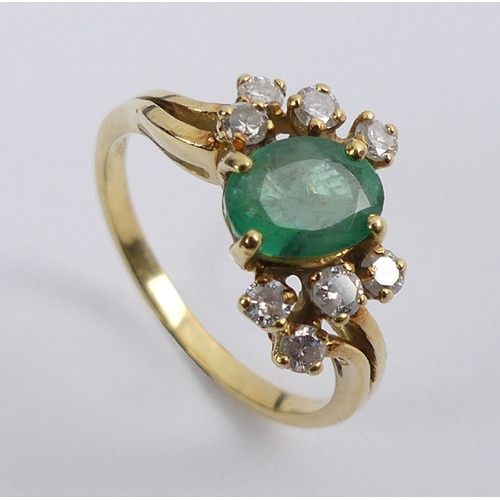 69 - 18ct gold, emerald and diamond ring, 3.4 grams, 10mm, size N.