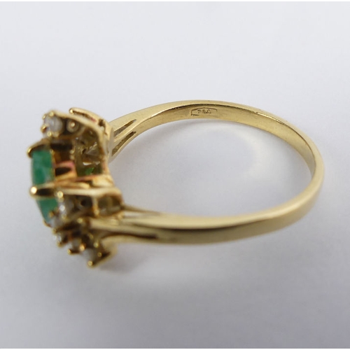 69 - 18ct gold, emerald and diamond ring, 3.4 grams, 10mm, size N.