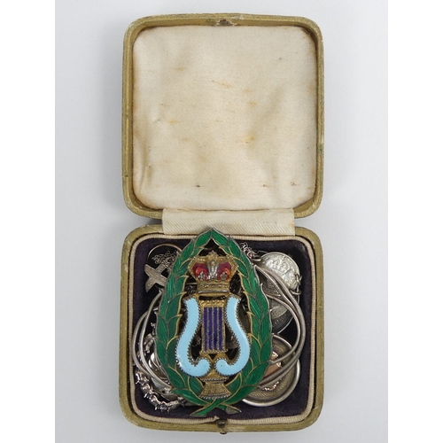 70A - Various items of silver jewellery and coins, including a minstrel enamelled jewel, 102 grams.