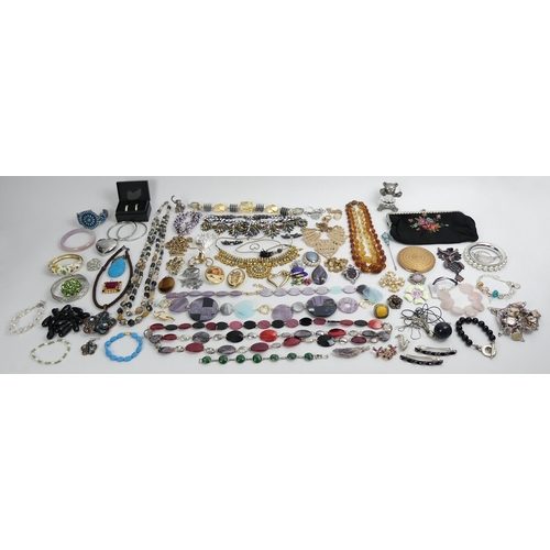 70C - A hat box of mixed costume jewellery, including an ornate paste set necklace.