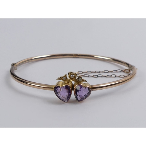 72 - 9ct gold, amethyst and seed pearl hinged bangle, 4.7 grams, 13.2mm.