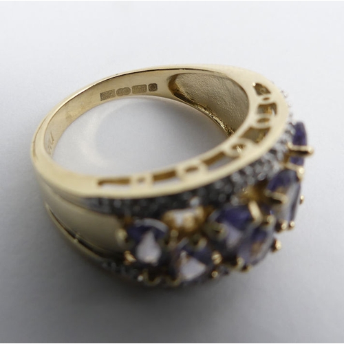 77 - 9ct gold tanzanite and diamond ring, 4.1 grams, 10.8mm, size K.