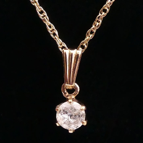 89 - 9ct gold, diamond (approximately .5ct) pendant and chain, 2.3 grams, chain 45cm, pendant 6mm diamete... 