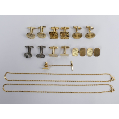 90 - A collection of cufflinks, including a 9ct gold pair and two plated gold examples.