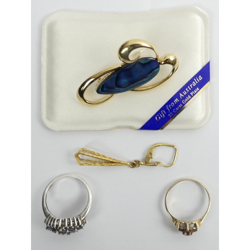 91 - 9ct gold ruby ring, silver and tanzanite ring, one earring and gold plated brooch.